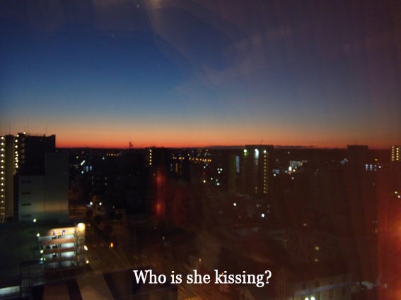Who is she kissing?