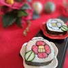 新年を祝う　紅白椿の飾り巻き寿司の画像